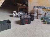 a pile of items sitting on the floor in a garage