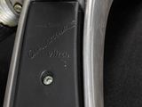 a close up of a metal object on a black surface