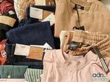 a pile of clothing that is sitting on a table