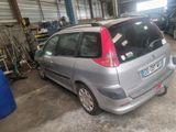a silver car that is parked in a garage