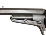an old gun with a wooden handle on a white background