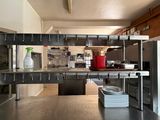 an image of a kitchen with stainless steel counter tops