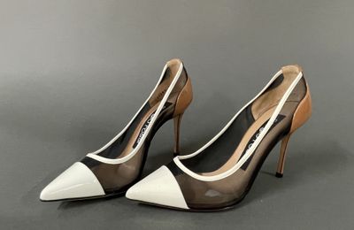 a close up of a pair of shoes on a gray surface