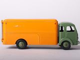 a toy truck that is sitting on a white surface