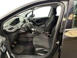 the interior of a car with the door open and the driver ' s seat down