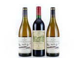 three bottles of wine sitting next to each other on a white surface