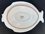 a white plate with a fish design on it