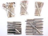 a lot of forks and spoons on the table