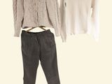 two sweaters and pants on a hanger next to each other