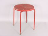 a small red stool with a red top on a white surface