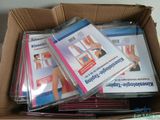 a box full of dvd ' s sitting on a table