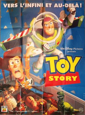 the poster for toy story is hanging on the wall