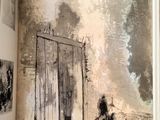 an open book with a picture of a man in a doorway