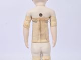 a wooden mannequin with a white body and a helmet on