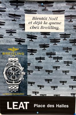 a poster on the wall of a store with a picture of a watch on it