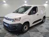 the white van is parked on a checkered floor in a room