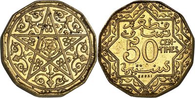 a gold coin with an ornate design on the front and back