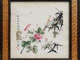 une peinture orientale représentant des fleurs et des oiseaux sur une natte en bambou