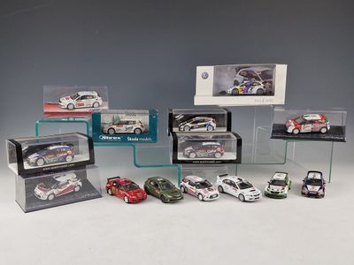 a lot of toy cars that are in a display case