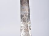 a very large knife that is on display on a table