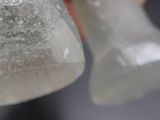 a person holding a piece of ice in their hand