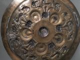 a metal plate with a design on it on a table