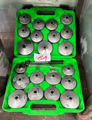 a green case with a bunch of tools inside of it