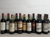 several bottles of wine are lined up in a row on a table