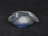 a small blue bowl with a gold design on it