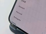 a close up of a cell phone with chinese writing on the screen