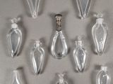 many glass bottles that are lined up on a table