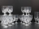 a lot of empty wine glasses sitting on a table