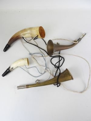 a lot of horns that are laying on a table