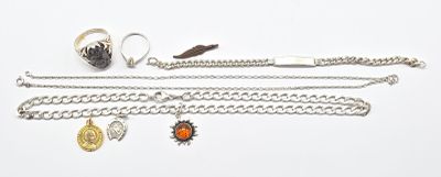 a lot of jewelry that is laying out on the table