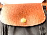 a close up of a brown and black bag