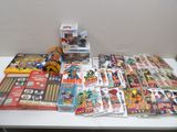 a lot of comic books on a white table