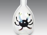 a glass vase with a picture of a crab inside of it