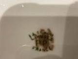 a close up of a white plate with a picture on it