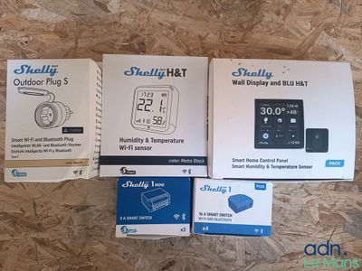 three boxes of the smart baby monitor are sitting on a wooden surface