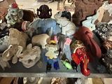 a lot of stuffed animals on a table in a room