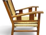 an image of a wooden chair with a woven seat cushion