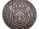 a close up of a coin with a crown on it