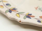 a white plate with a floral design on it