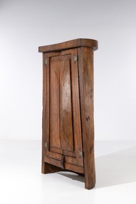 a small wooden cabinet with a door on it