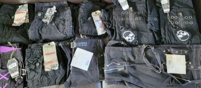 many pairs of jeans that are on display in the store