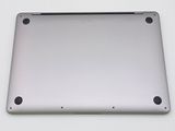 a close up of the bottom of a silver laptop computer