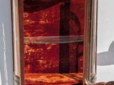a cabinet that has a red velvet covering on it
