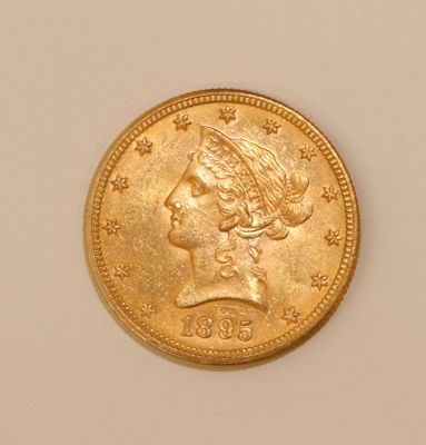 an image of a gold coin with a woman ' s head on it