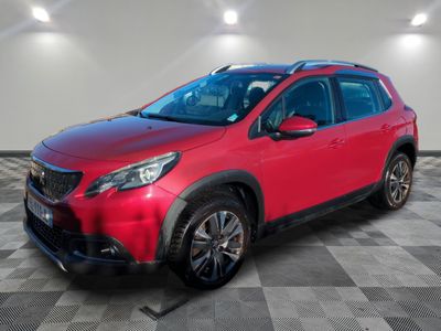 a red toyota rav parked on a checkered floor