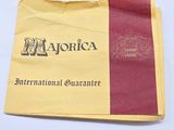 an image of a yellow and red paper bag with a logo on it